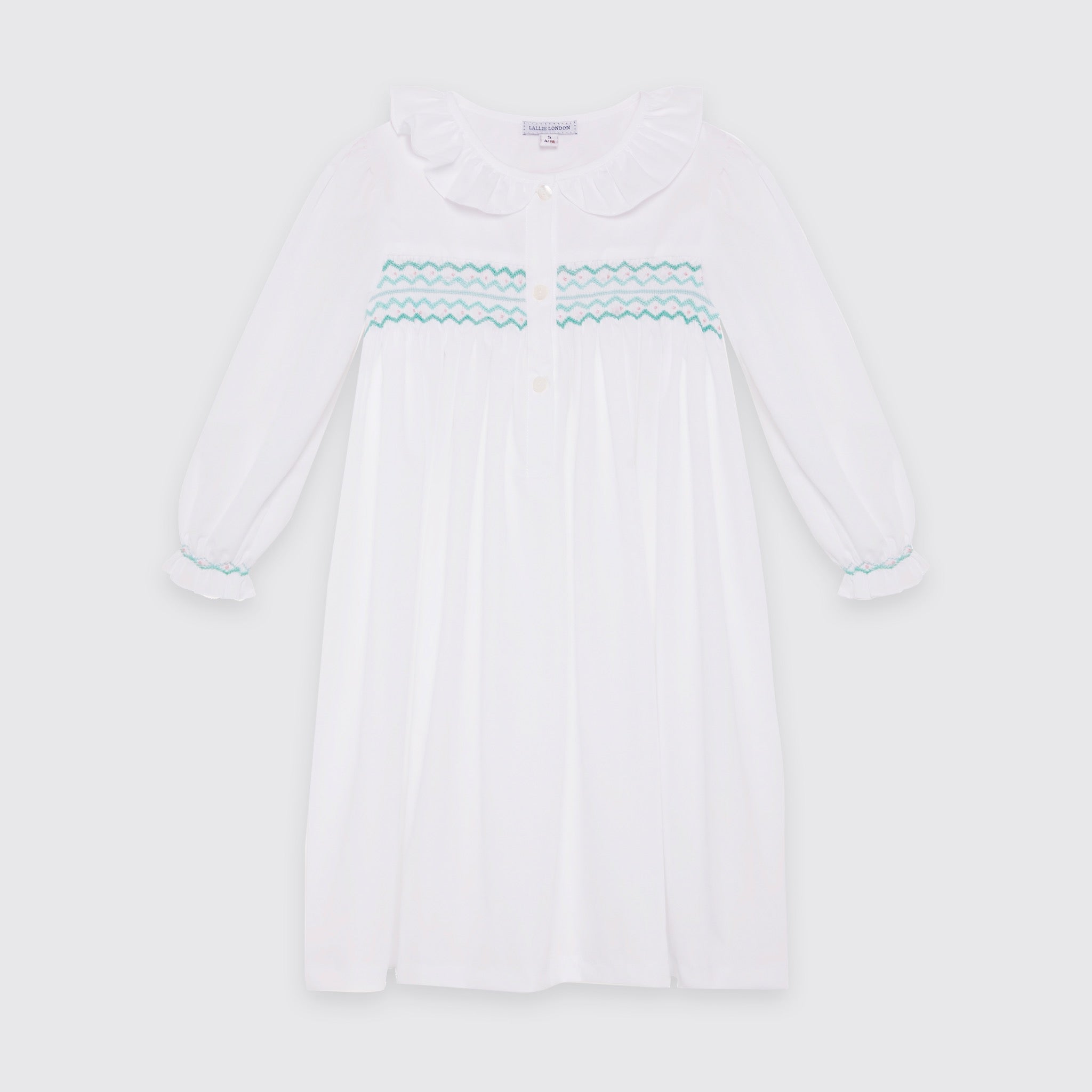 White nightdress with hand smocked.  Smocking panel in mint green and pale pink.  Traditional nightwear for children.  Smocked cuff. Frill collar cotton nightie 